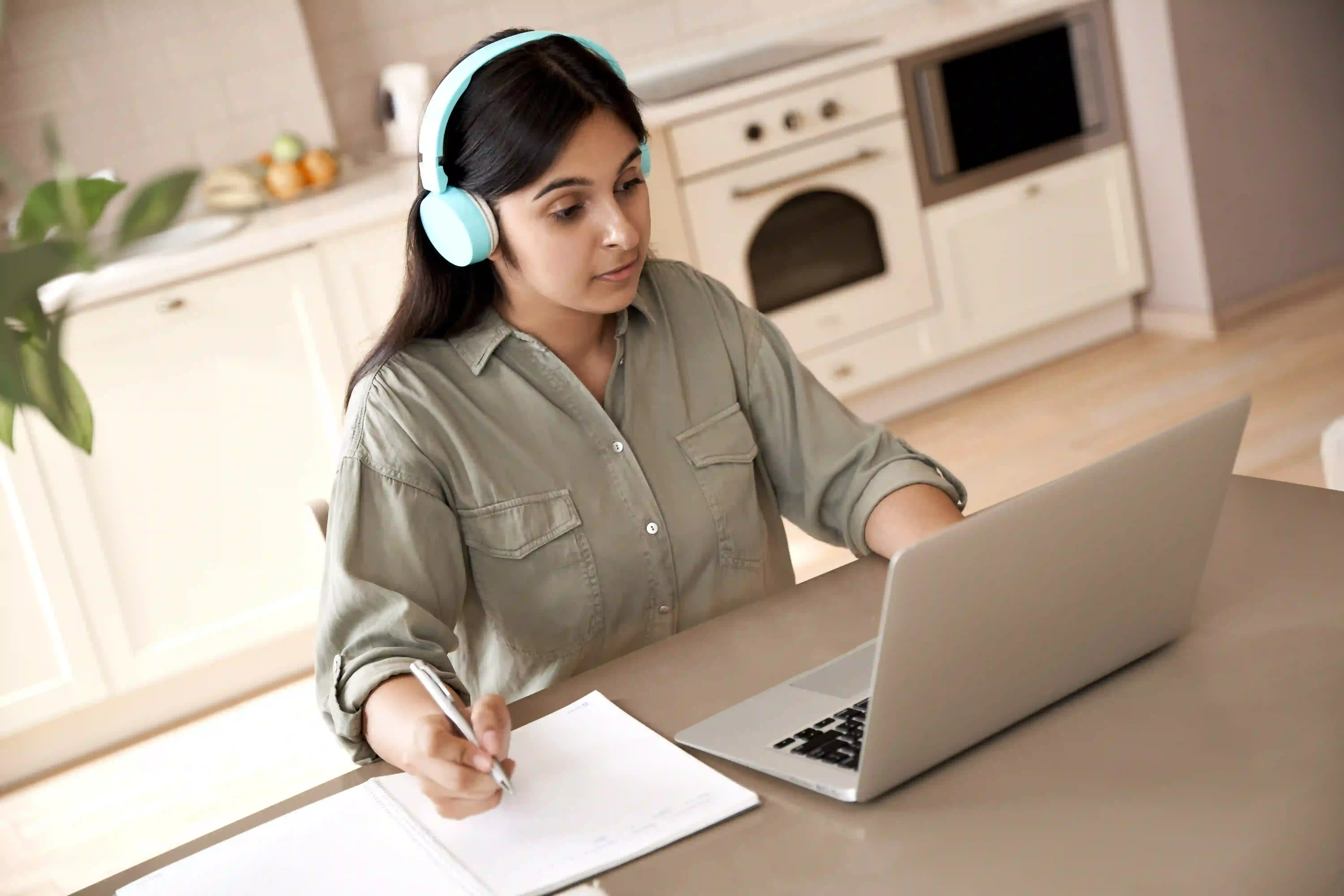 A student in Canada attending an online elementary French tutoring session on a laptop