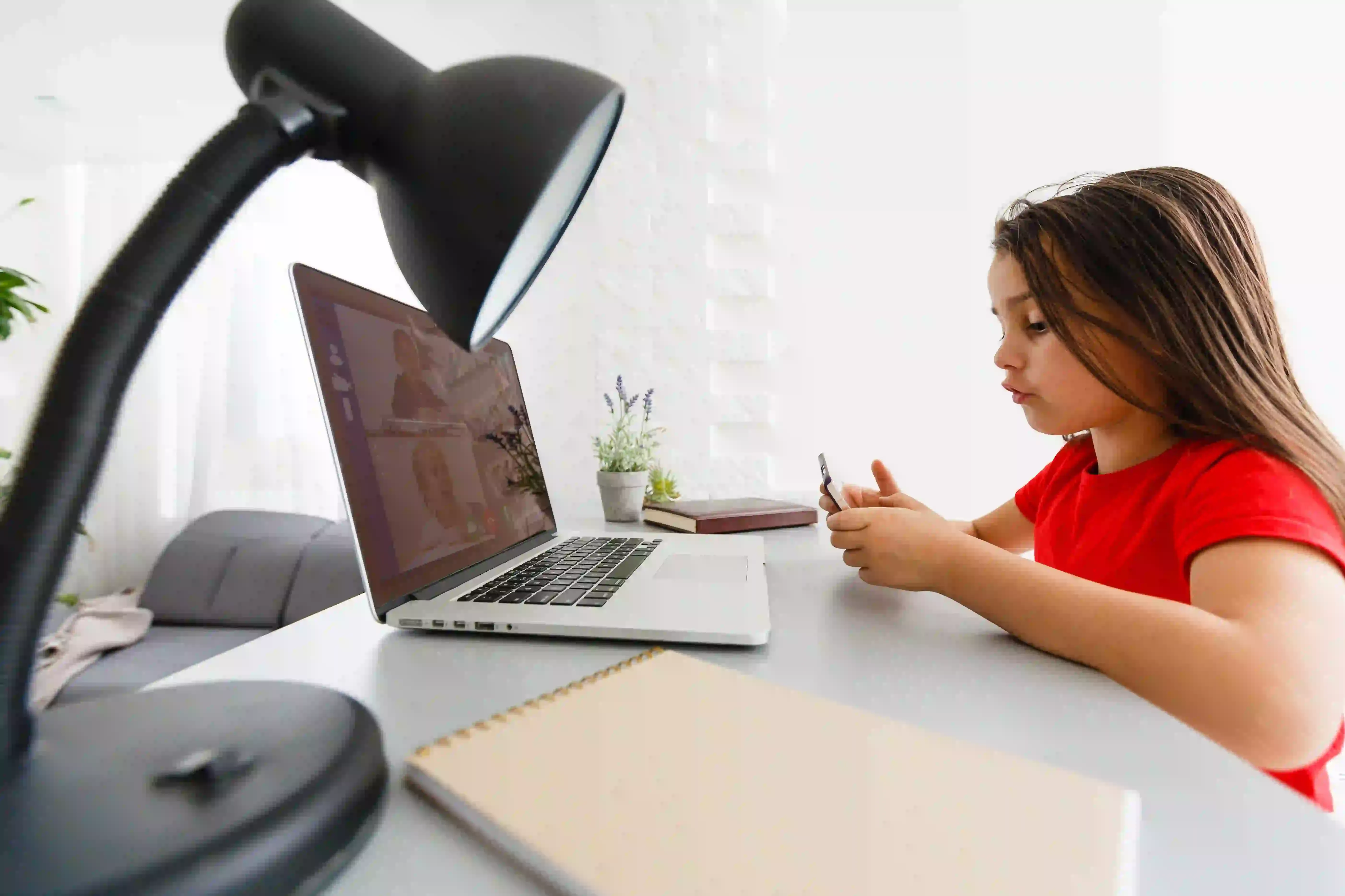 A student in Canada attending an online humanities tutoring session on a laptop