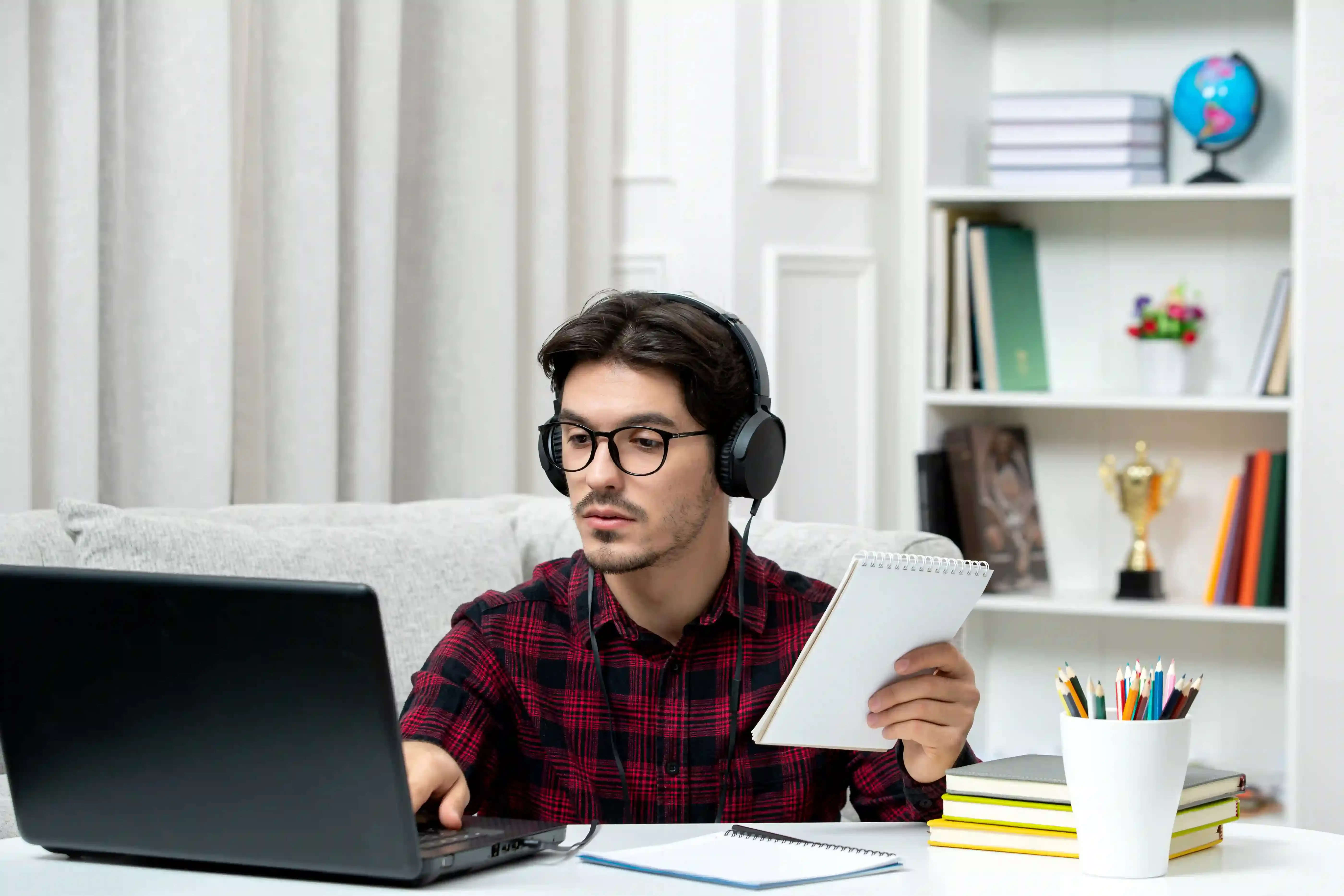 A high school student studying during an online Social Studies 10-30 tutoring session