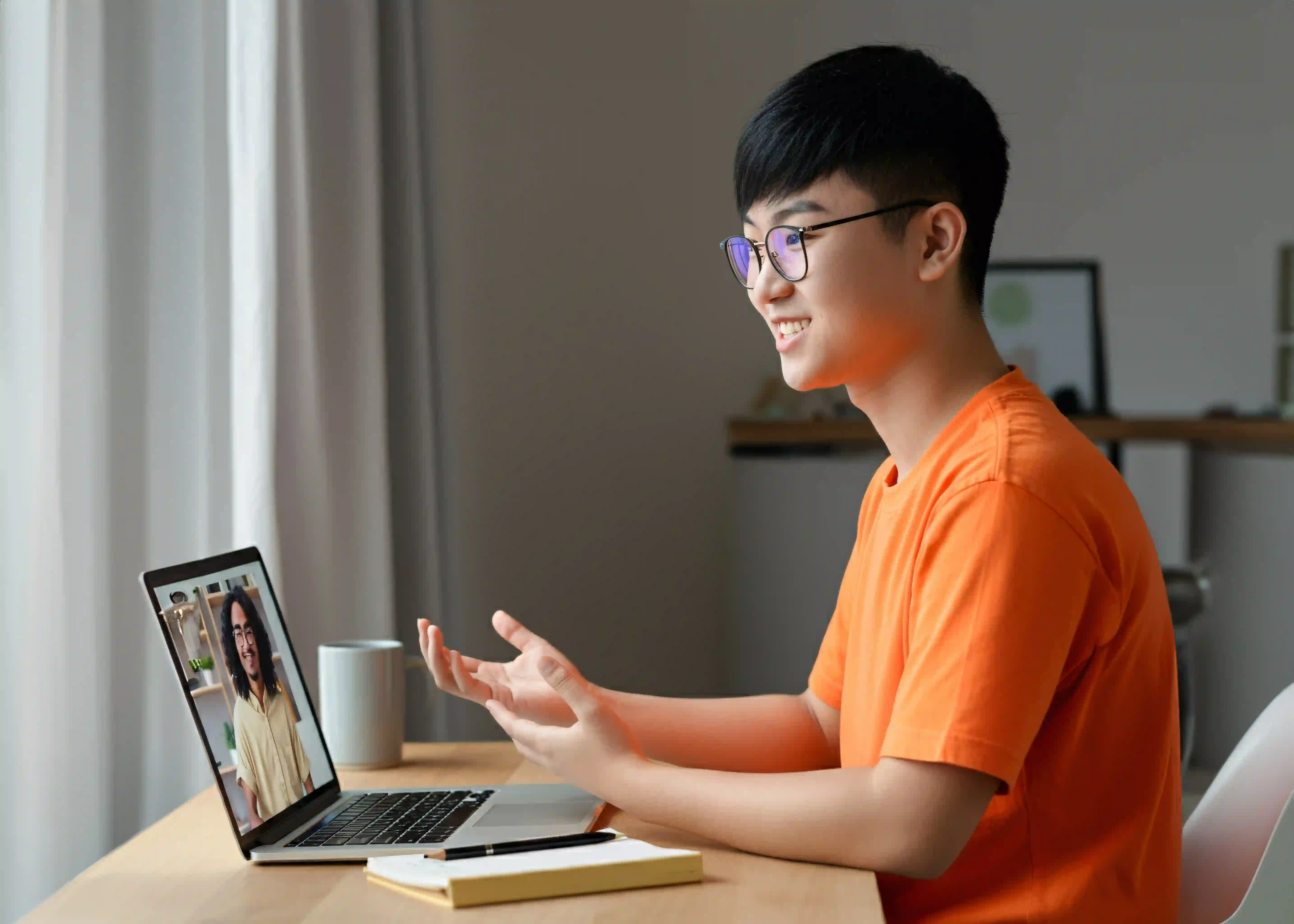 A Singapore student in a video call with their online Legal Studies tutor